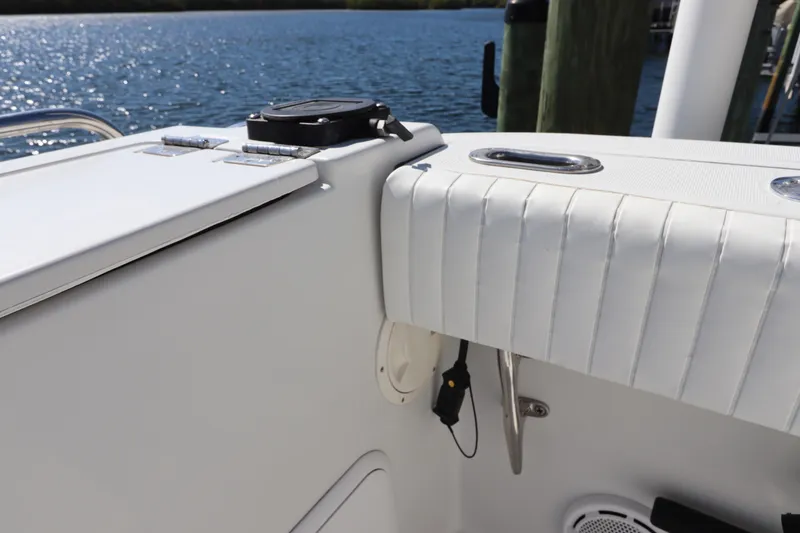 Slide: The Image of 2008 Glacier Bay 3080 Coastal Runner boat interior with white seating and water view. - 20