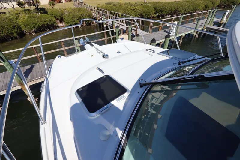 Slide: The Image of 2008 Glacier Bay 3080 Coastal Runner boat docked by wooden pier. - 25