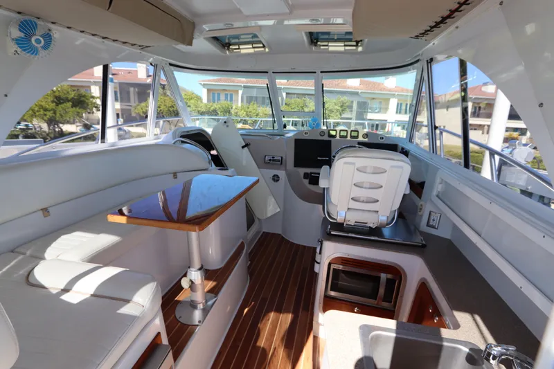 Slide: The Image of Interior of 2008 Glacier Bay 3080 Coastal Runner boat with modern helm and seating. - 31