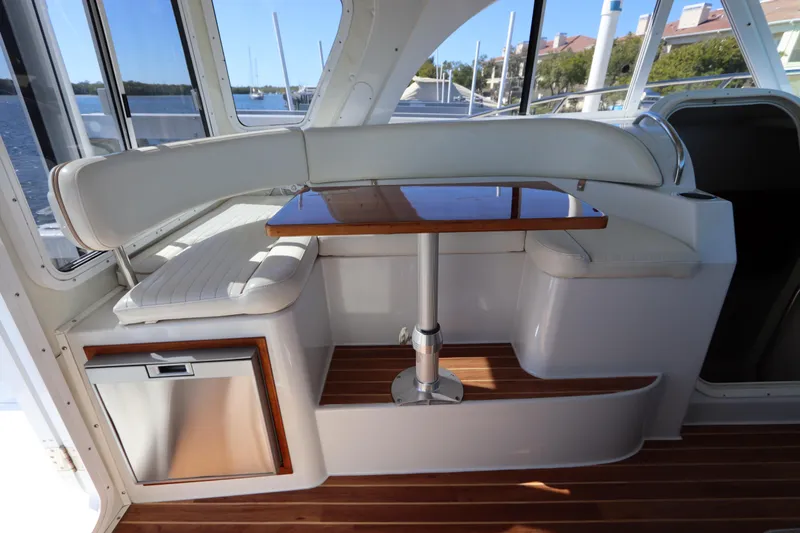 Slide: The Image of 2008 Glacier Bay 3080 Coastal Runner interior with seating and wooden table. - 32