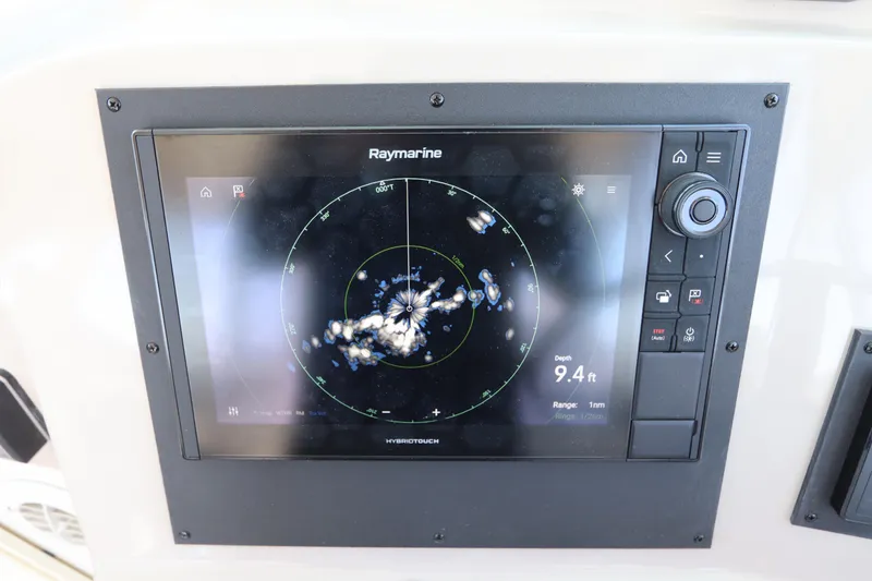 Slide: The Image of Raymarine navigation display on 2008 Glacier Bay 3080 Coastal Runner, showing radar and depth information. - 44