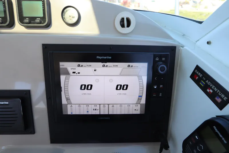 Slide: The Image of Dashboard of 2008 Glacier Bay 3080 Coastal Runner with Raymarine display and controls. - 45