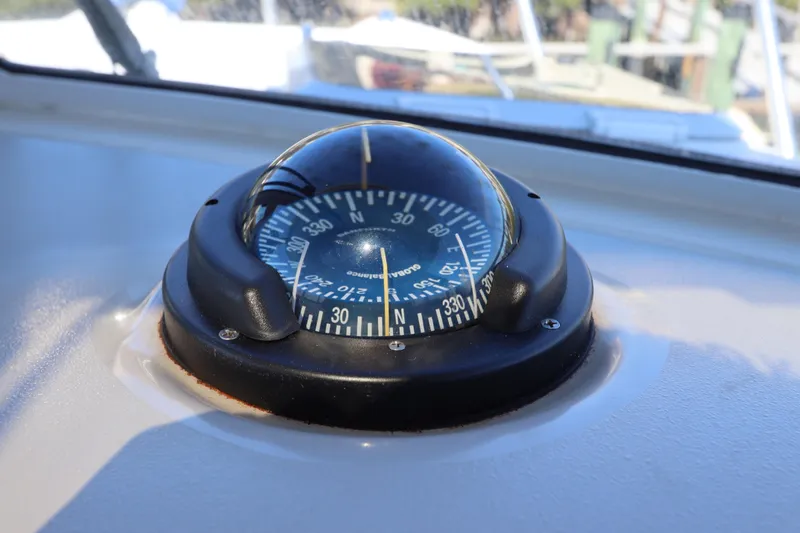 Slide: The Image of Compass on 2008 Glacier Bay 3080 Coastal Runner boat dashboard. - 48