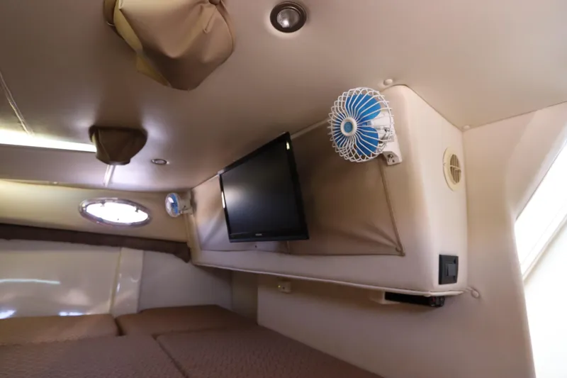 Slide: The Image of Interior cabin of 2008 Glacier Bay 3080 Coastal Runner with TV and fan. - 55