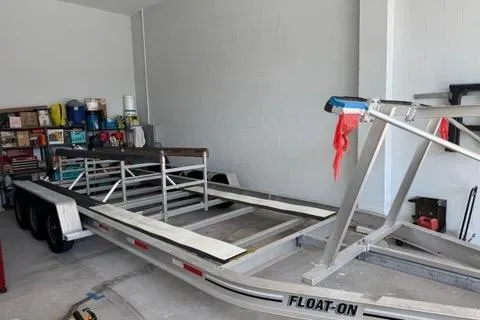 Slide: The Image of Empty boat trailer in garage, Glacier Bay 3080 Coastal Runner, 2008 model. - 62