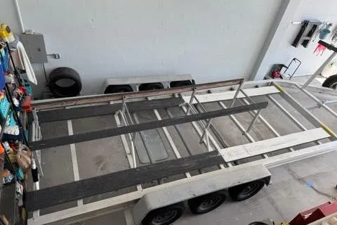 Slide: The Image of 2008 Glacier Bay 3080 Coastal Runner trailer in a garage, viewed from above. - 63