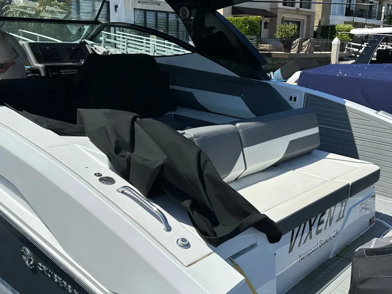 Slide: The Image of The image shows the stern of a 2021 Cruisers Yachts 38 GLS with gray upholstery. - 28