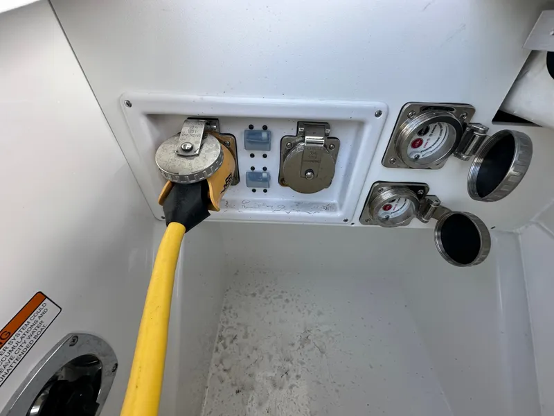 Slide: The Image of A boat power connection with a yellow cable and multiple sockets. - 48