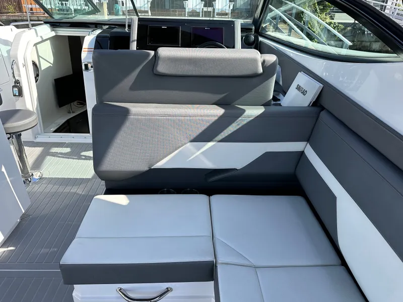 Slide: The Image of The 2021 Cruisers Yachts 38 GLS features a stylish seating area with gray and white upholstery. - 33