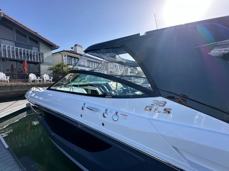 Slide: The Image of A luxurious 2021 Cruisers Yachts 38 GLS docked, featuring sleek design and glossy finish. - 25