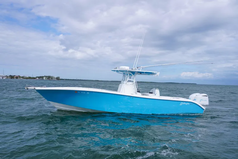 The Image of 2011 Yellowfin 32 Offshore boat on open water under cloudy sky. - 1