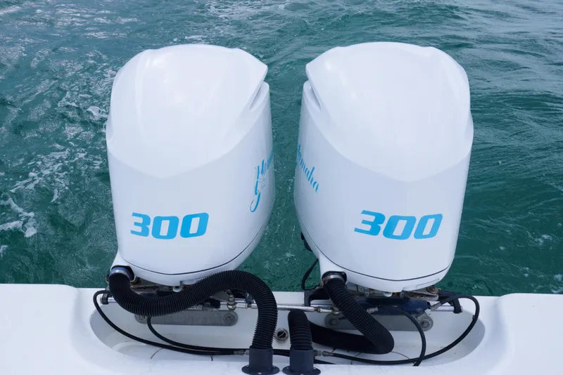 Slide: The Image of Twin 300 horsepower outboard engines on a 2011 Yellowfin 32 Offshore boat. - 23