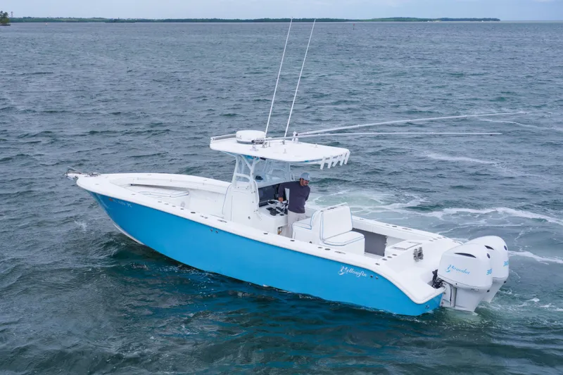 Slide: The Image of 2011 Yellowfin 32 Offshore boat cruising on open water. - 9