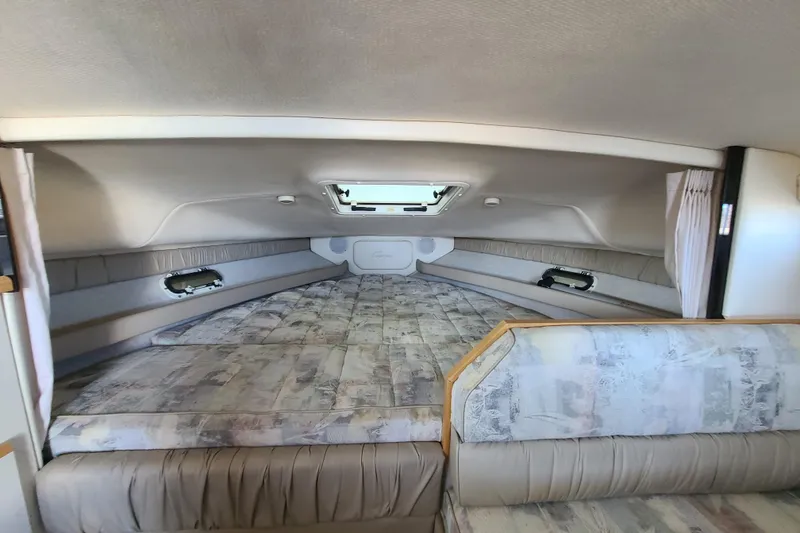 Slide: The Image of 1998 Bayliner 2855 Ciera Sunbridge cabin interior with spacious sleeping area. - 11