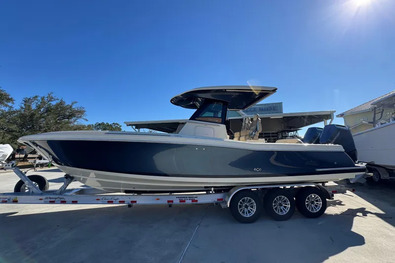 The Image of 2026 Chris-Craft Catalina 31 boat on trailer under clear blue sky. - 1