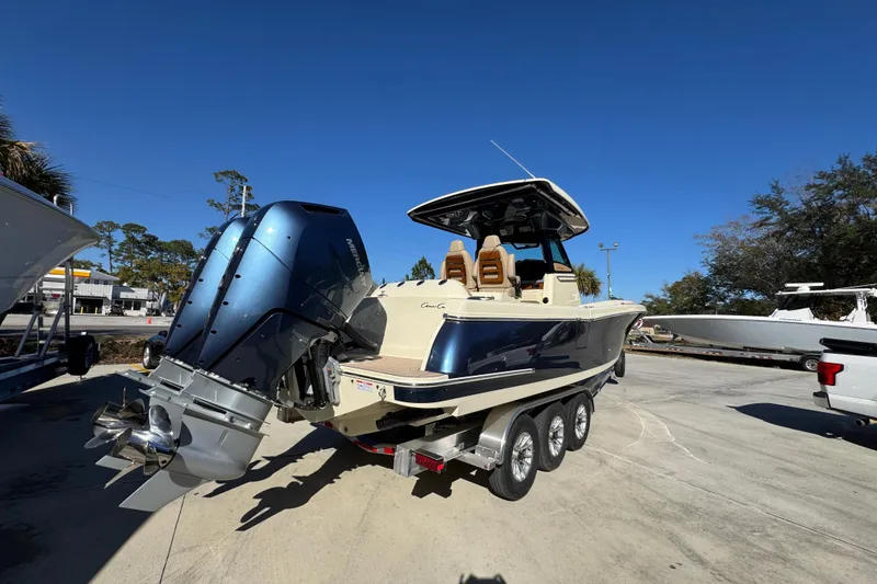 Slide: The Image of 2026 Chris-Craft Catalina 31 boat with dual outboard engines on a trailer. - 14