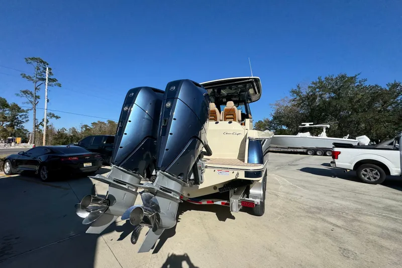 Slide: The Image of 2026 Chris-Craft Catalina 31 boat with dual outboard engines in a sunny outdoor setting. - 15