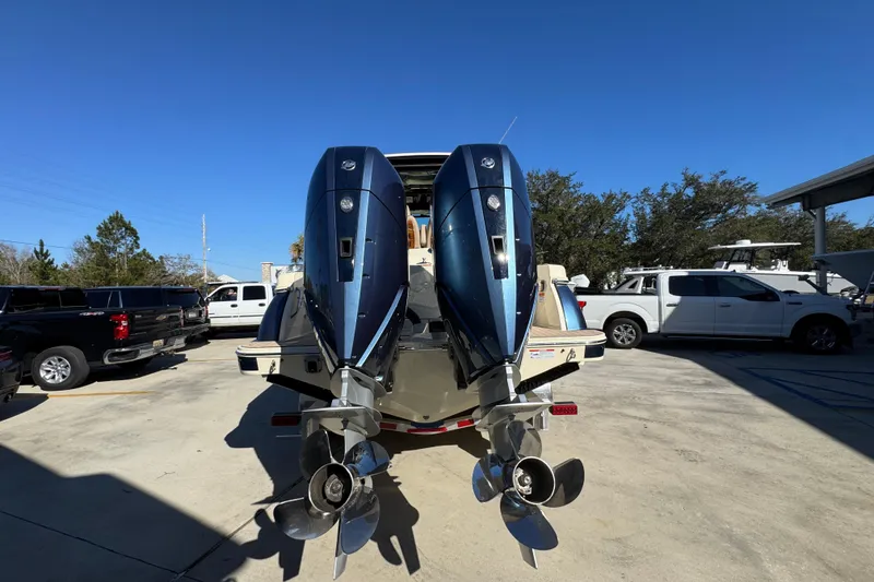 Slide: The Image of 2026 Chris-Craft Catalina 31 with dual outboard engines in a parking lot. - 16