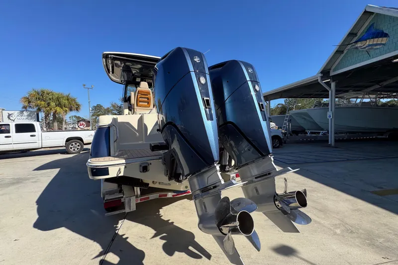 Slide: The Image of 2026 Chris-Craft Catalina 31 with dual outboard engines in a marina setting. - 17