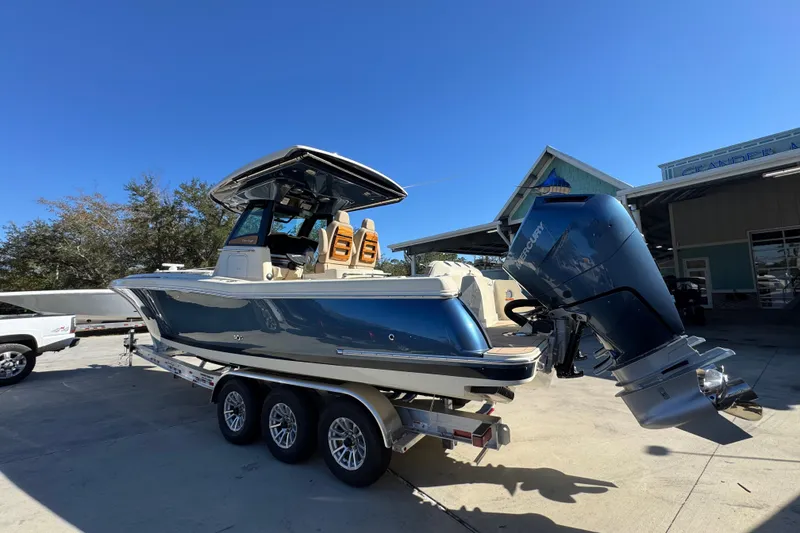 Slide: The Image of 2026 Chris-Craft Catalina 31 boat on trailer, featuring a sleek design and powerful outboard motor. - 19