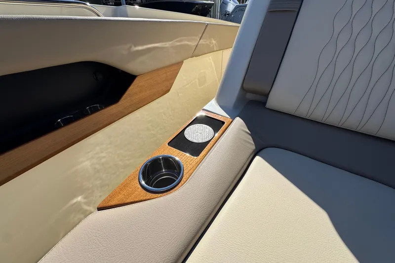Slide: The Image of 2026 Chris-Craft Catalina 31 interior detail with cup holders and elegant upholstery. - 25