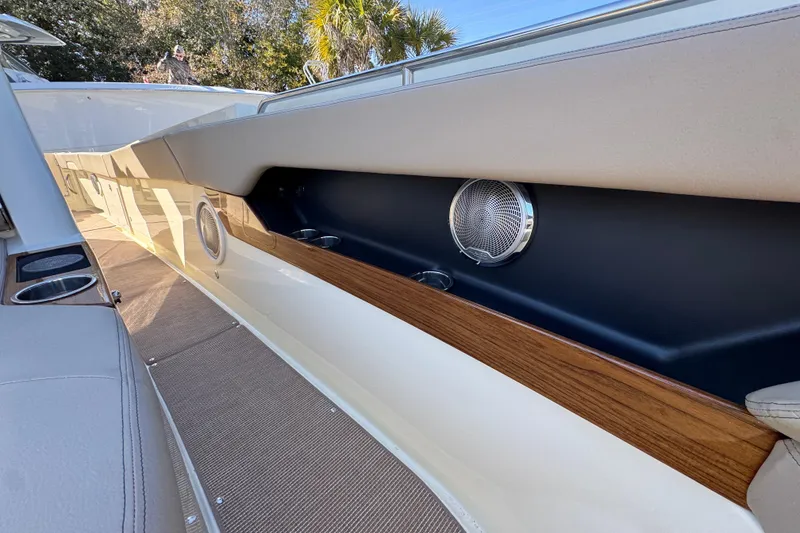 Slide: The Image of 2026 Chris-Craft Catalina 31 interior with wood accents and speaker detail. - 27
