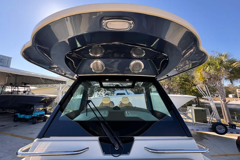 Slide: The Image of 2026 Chris-Craft Catalina 31 boat with sleek design and modern features, docked outdoors. - 28