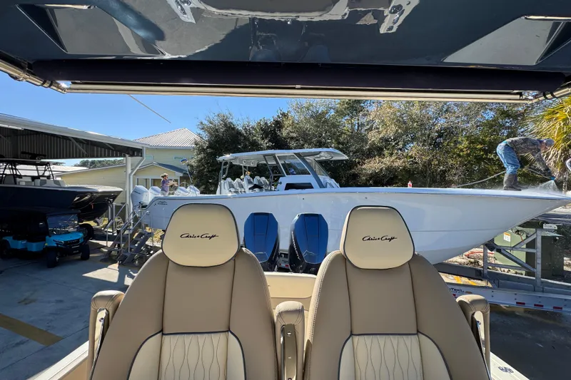 Slide: The Image of 2026 Chris-Craft Catalina 31 boat in marina, viewed from interior seats. - 36