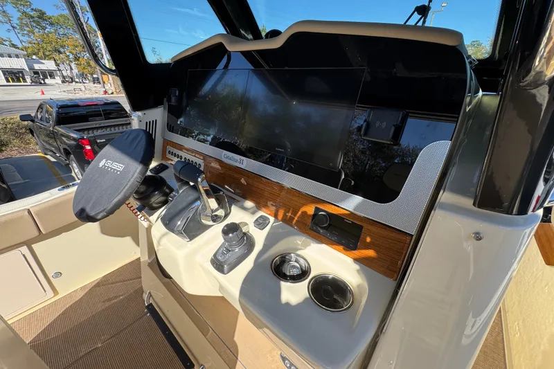 Slide: The Image of 2026 Chris-Craft Catalina 31 helm with modern controls and sleek design. - 40