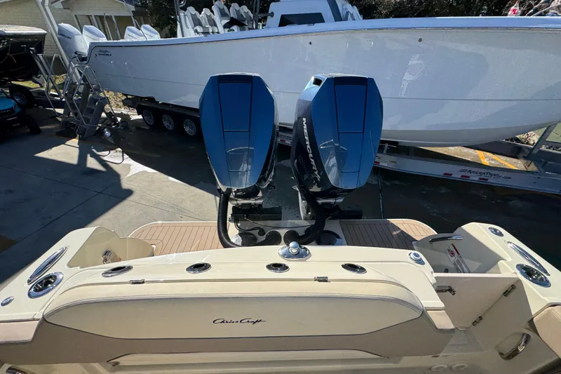 Slide: The Image of 2026 Chris-Craft Catalina 31 with dual Mercury outboard engines, docked on a trailer. - 48