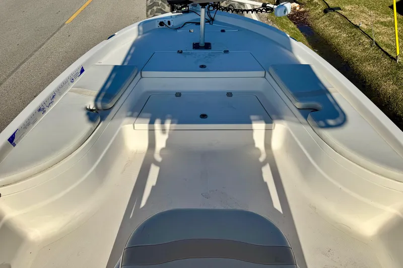 Slide: The Image of 2006 NauticStar 2200 NauticBay boat interior with seating and storage compartments. - 12