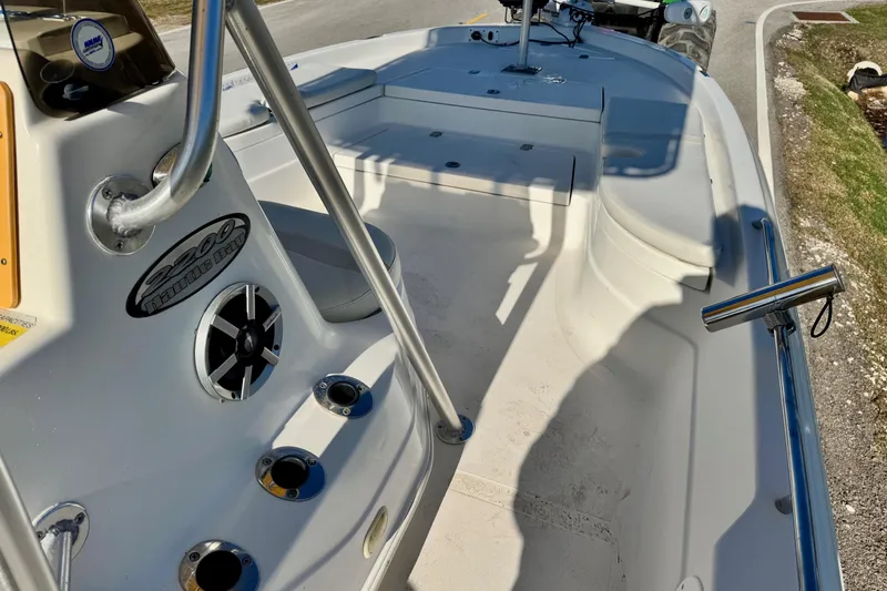 Slide: The Image of 2006 NauticStar 2200 NauticBay boat interior with seating and rod holders. - 13