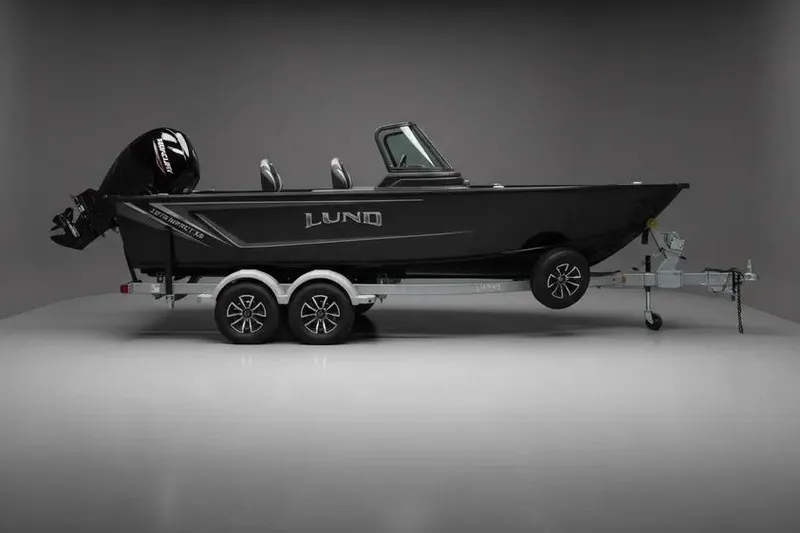 The Image of 2025 Lund 1875 Impact XS Sport boat on trailer, side view in studio setting. - 0
