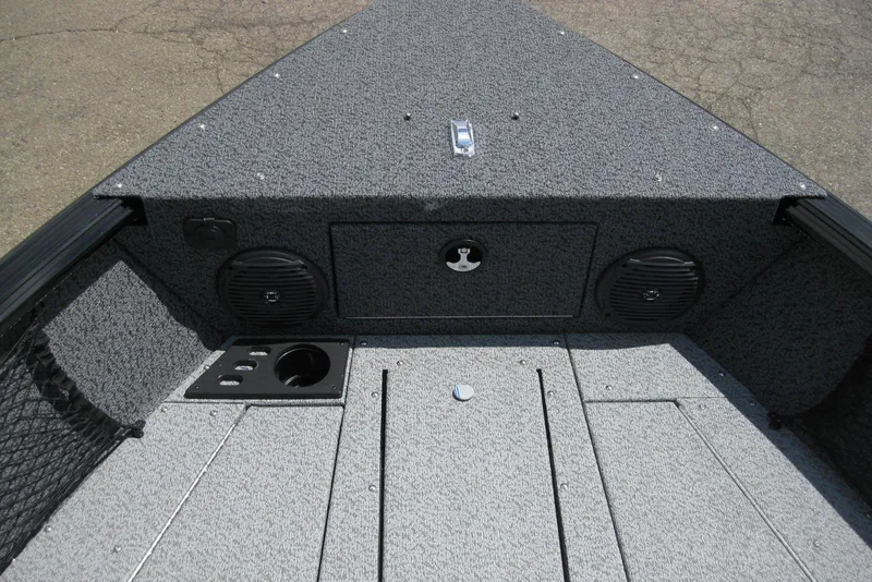 Slide: The Image of 2025 Lund 1875 Impact XS Sport boat interior with speakers and storage compartments. - 16