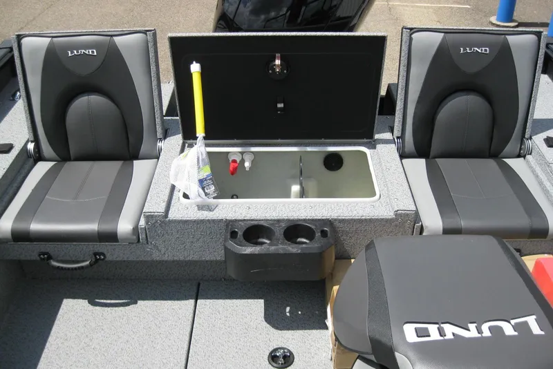 Slide: The Image of 2025 Lund 1875 Impact XS Sport boat interior with seating and storage compartments. - 9