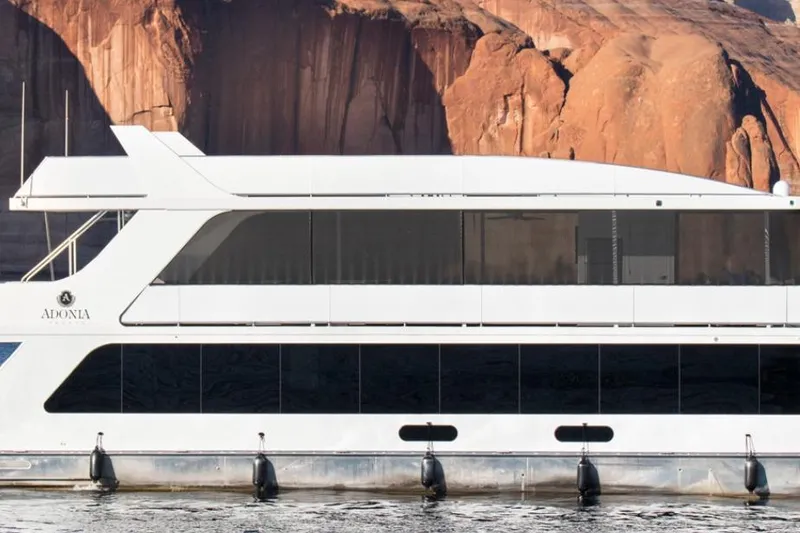 The Image of Modern Adonia Radiance Share #3 yacht against rocky cliffs, 2022 model. - 1