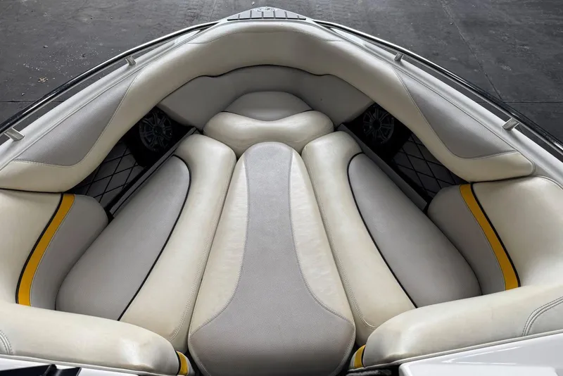 Slide: The Image of 2005 Malibu Wakesetter VLX boat interior with white and yellow cushioned seating. - 17