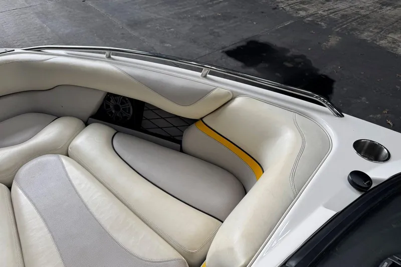 Slide: The Image of 2005 Malibu Wakesetter VLX interior with white and yellow cushioned seating. - 18