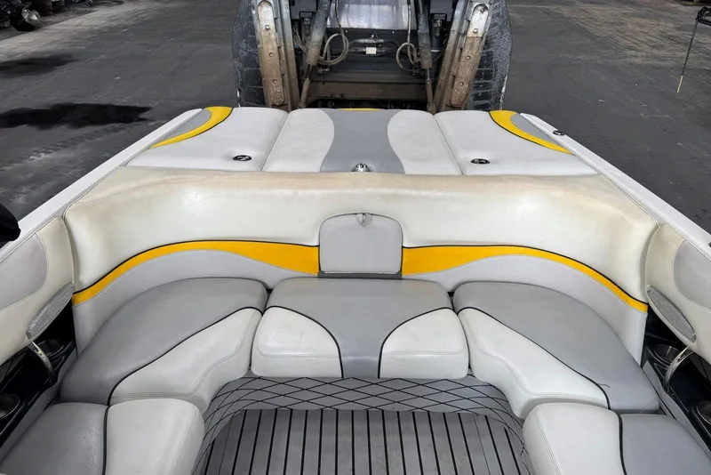 Slide: The Image of 2005 Malibu Wakesetter VLX boat interior with gray and yellow seating. - 22