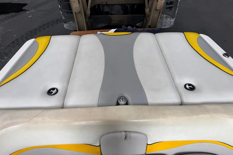 Slide: The Image of 2005 Malibu Wakesetter VLX boat seat with yellow and gray upholstery design. - 24