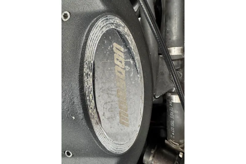 Slide: The Image of Close-up of a 2005 Malibu Wakesetter VLX engine component with visible branding. - 34