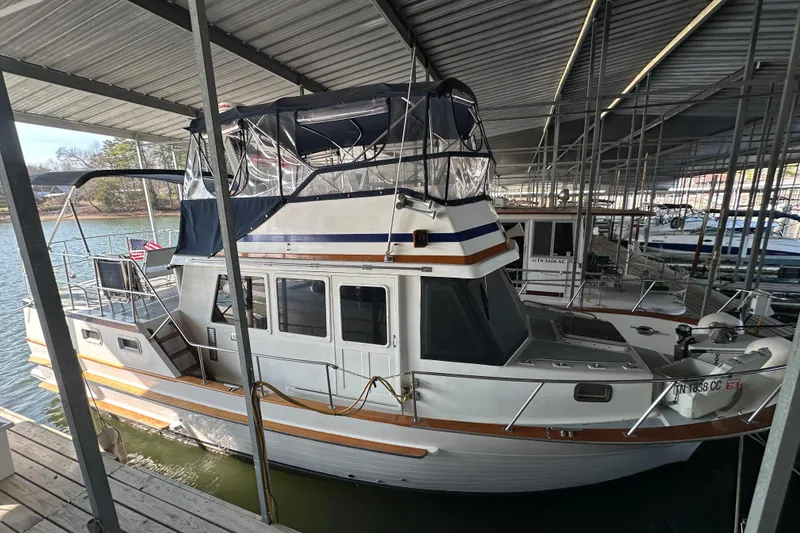 The Image of 1986 Present Yachts 35 MotorYacht docked in a covered marina. - 0