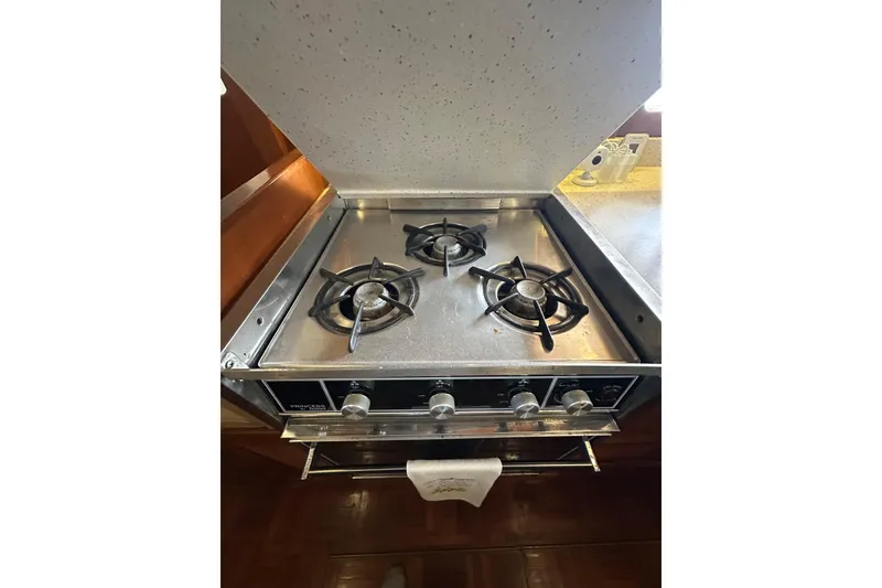 Slide: The Image of Stainless steel stove in 1986 Present Yachts 35 MotorYacht kitchen. - 14