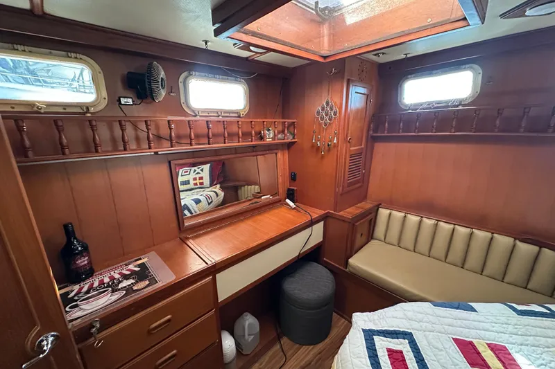Slide: The Image of 1986 Present Yachts 35 MotorYacht cabin with wood interior and cozy seating. - 21