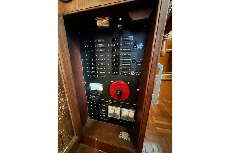 Slide: The Image of Electrical panel of a 1986 Present Yachts 35 MotorYacht, featuring switches and gauges. - 32