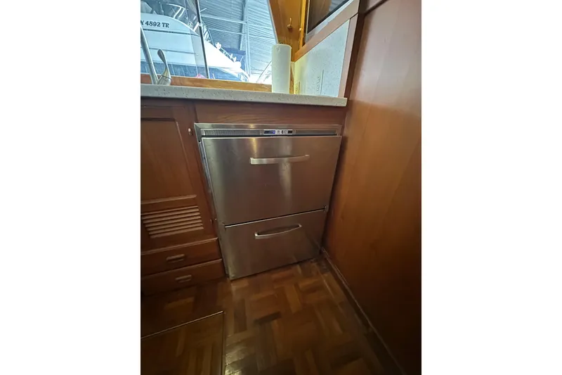 Slide: The Image of Stainless steel dishwasher in 1986 Present Yachts 35 MotorYacht kitchen. - 12