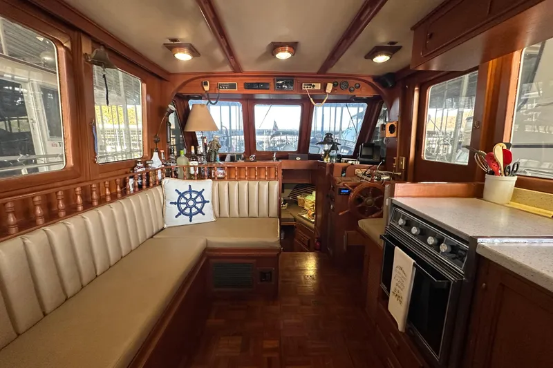 Slide: The Image of Interior of 1986 Present Yachts 35 MotorYacht with cozy seating and nautical decor. - 8
