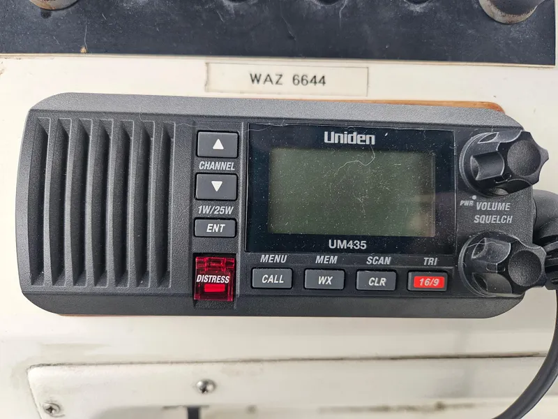 Slide: The Image of Uniden UM435 marine radio on 1991 Tollycraft Euro Sport Sedan dashboard. - 46