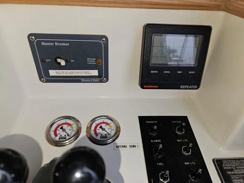 Slide: The Image of Control panel of a 1991 Tollycraft Euro Sport Sedan with gauges and switches. - 48