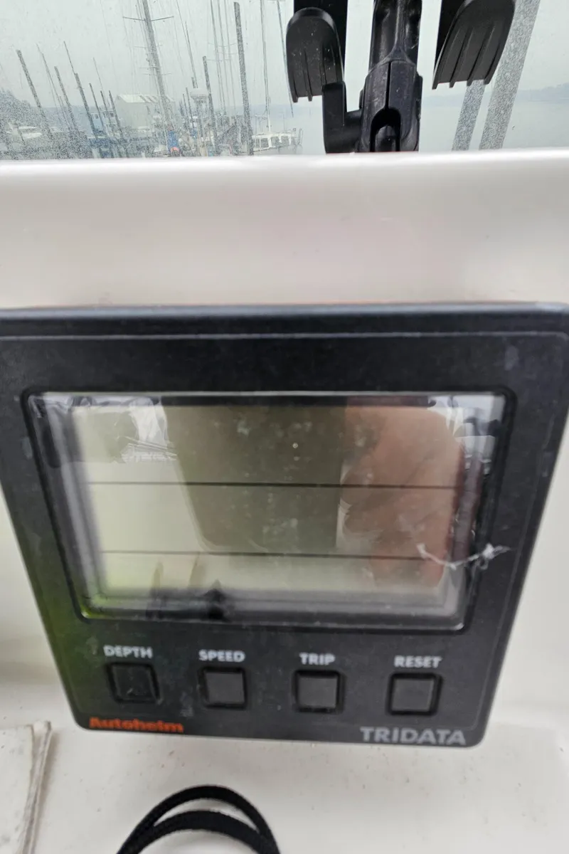 Slide: The Image of Close-up of a 1991 Tollycraft Euro Sport Sedan boat's Tridata display panel. - 49